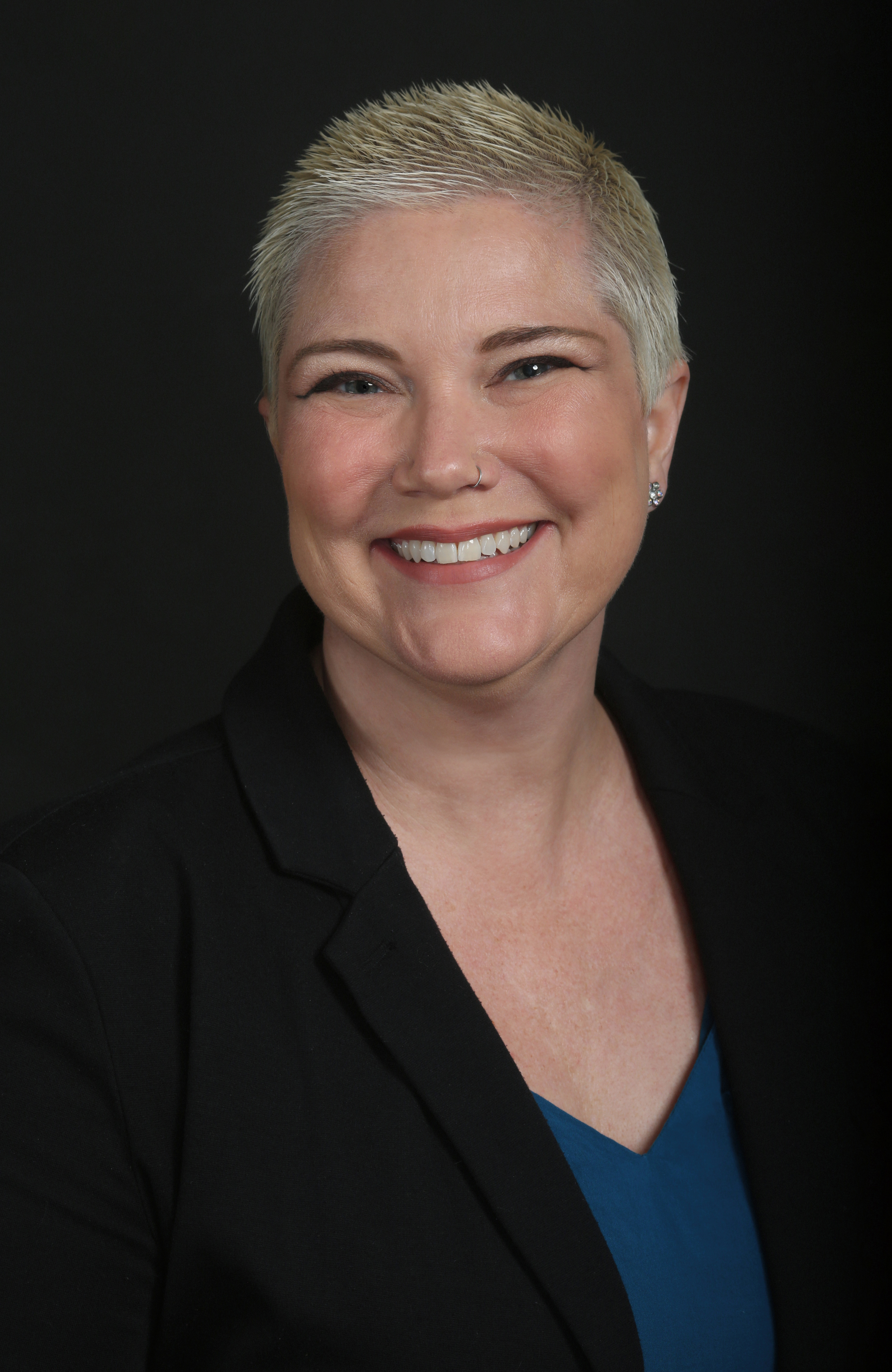 Emily Haraldson in a blue top and black blazer