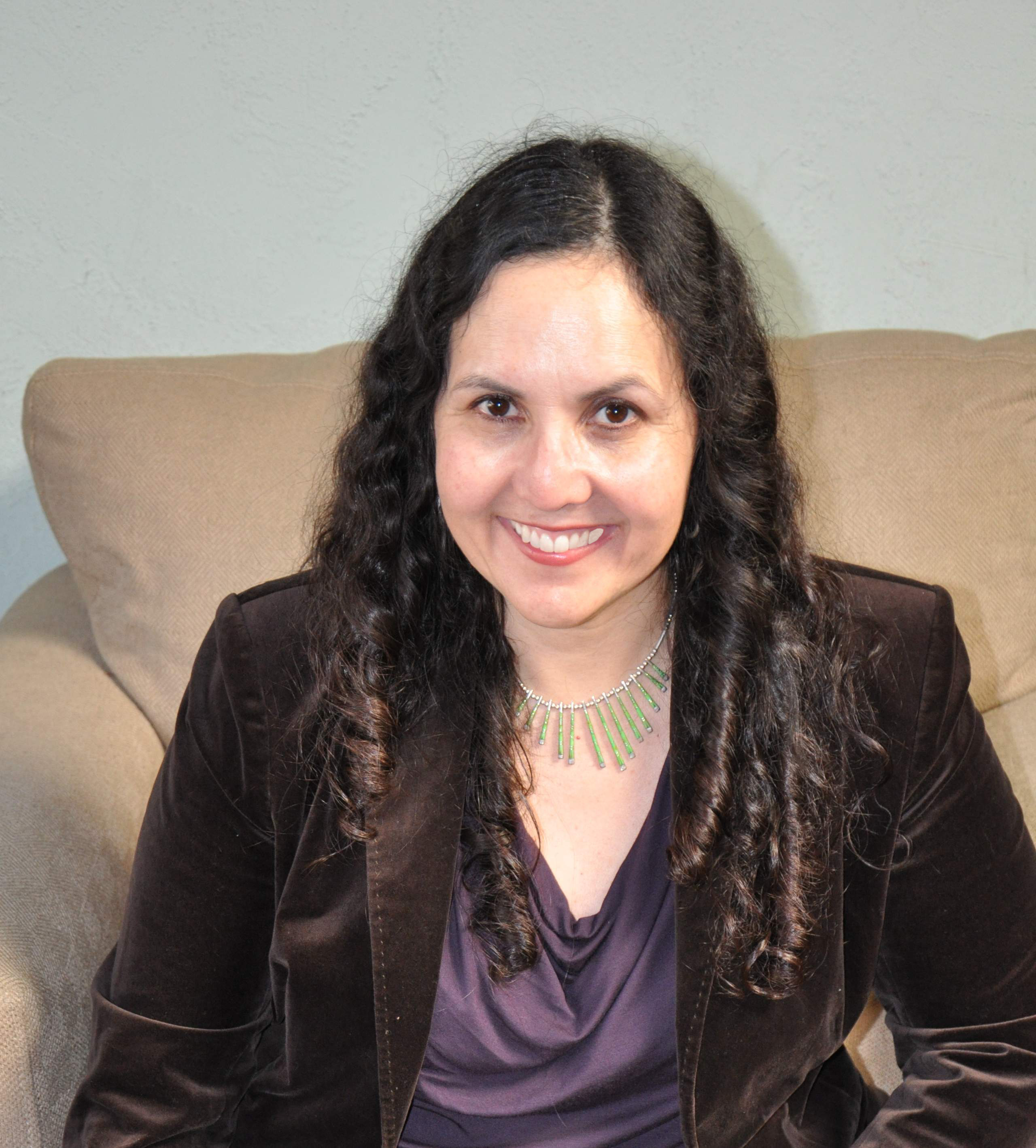 Ruby Christian-Brougham in a purple top and blazer jacket